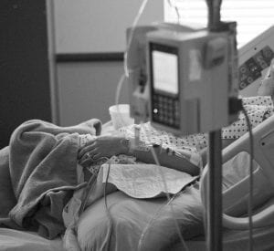 Health Insurance woman in hospital bed